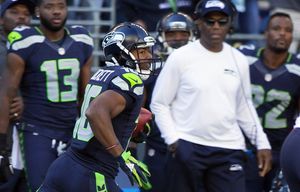 Seahawks wide receiver Tyler Lockett looks for a seam as he returns a kickoff 105 yards for a touchdown to start the third quarter against the Chicago Bears at CenturyLink Field in Seattle Sunday September 27, 2015.