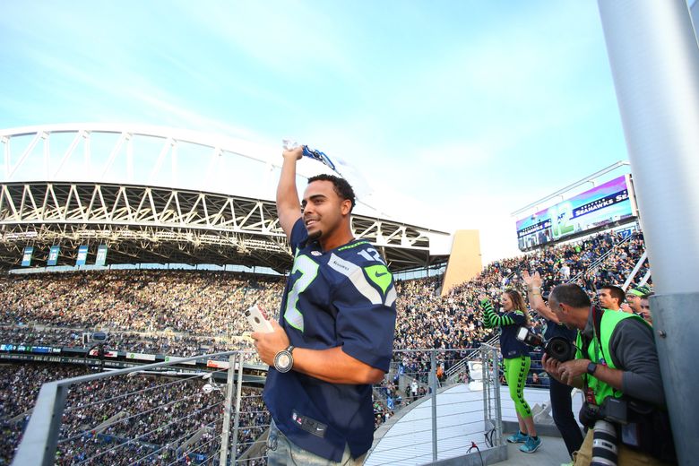 Nelson Cruz Raises 12th Man Flag at Seahawks Game, by Mariners PR