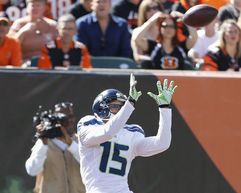 Seattle Seahawks Russell Wilson completes a pass to his receiver