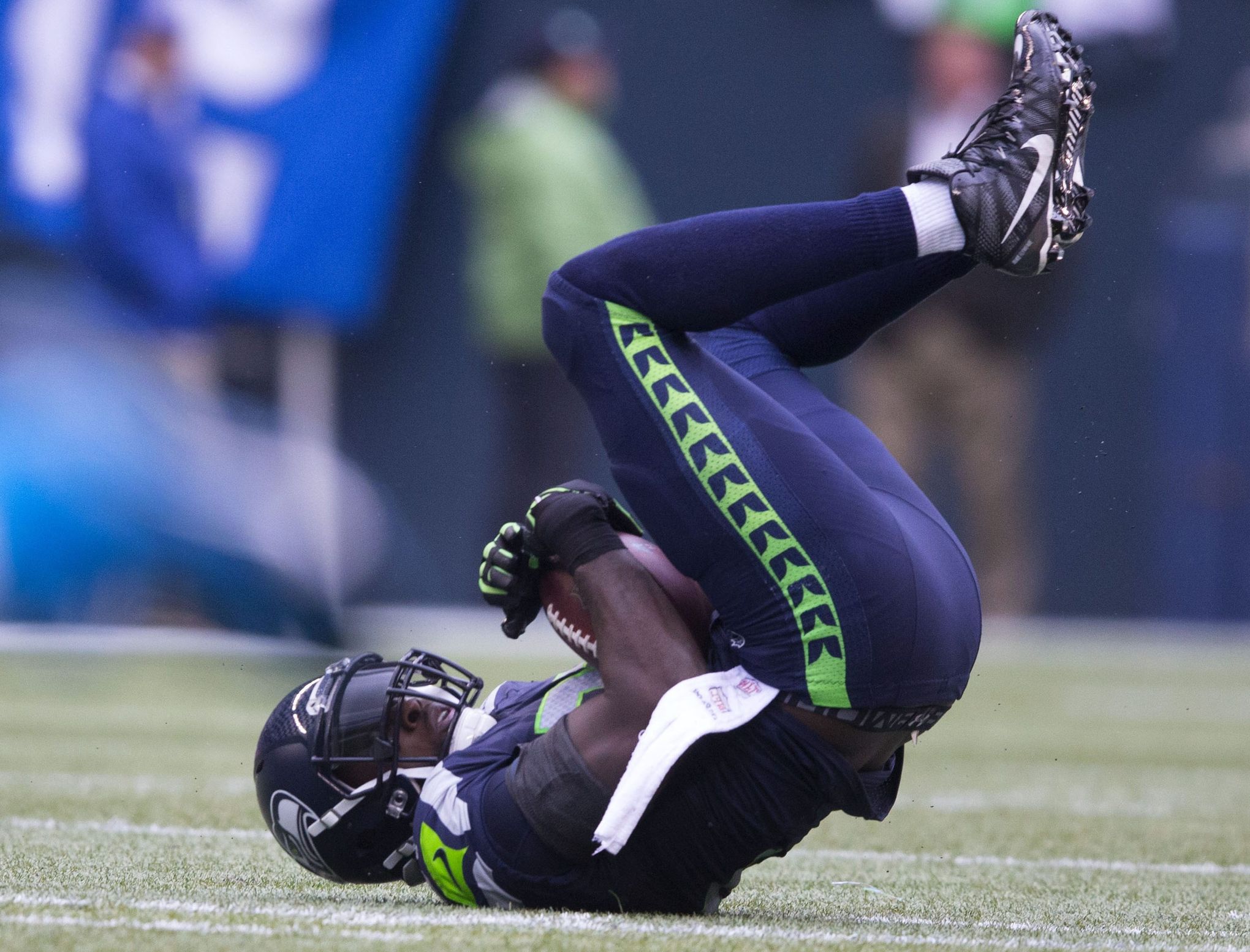 Carolina Panthers quarterback Cam Newton (1) walks off the field after  throwing an interception to Seattle Seahawks safety Kam Chancellor in the  fourth quarter during NFC Divisional Playoff action at CenturyLink Field