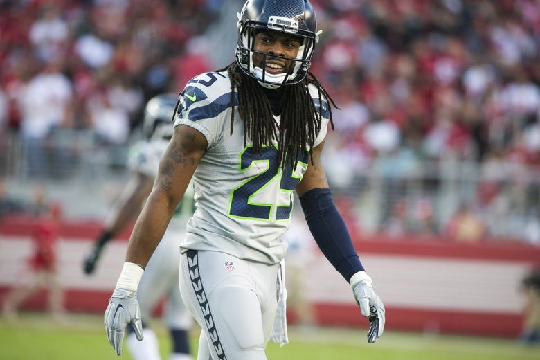 Former Seattle Seahawks WR tackles Richard Sherman by the hair