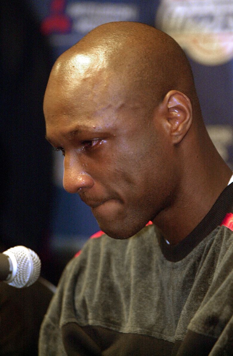 FILE – In this Nov. 7, 2001, file photo, Los Angeles Clippers basketball player Lamar Odom reacts during a a news conference where he admitted using marijuana, in Los Angeles. Odom, who was embraced by teammates and television fans alike for his Everyman approach to fame, was found face-down and alone Tuesday, Oct. 13, 2015,  after spending four days at the Love Ranch, a legal Nevada brothel. (AP Photo/Kim D. Johnson, File)