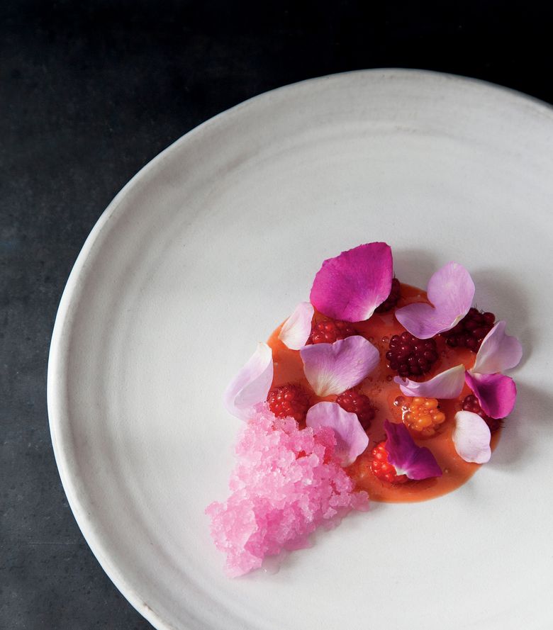 A dish of Nootka rose petals and salmonberries is among the recipes in “Sea and Smoke.” (Charity Burggraaf)