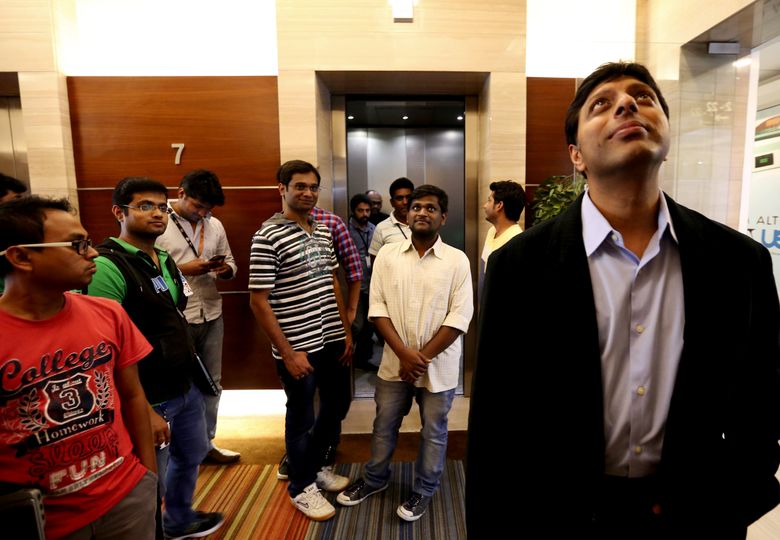 Amit Agarwal, head of Amazon in India, waits for an elevator to his office in Bangalore.  (Alan Berner / The Seattle Times)