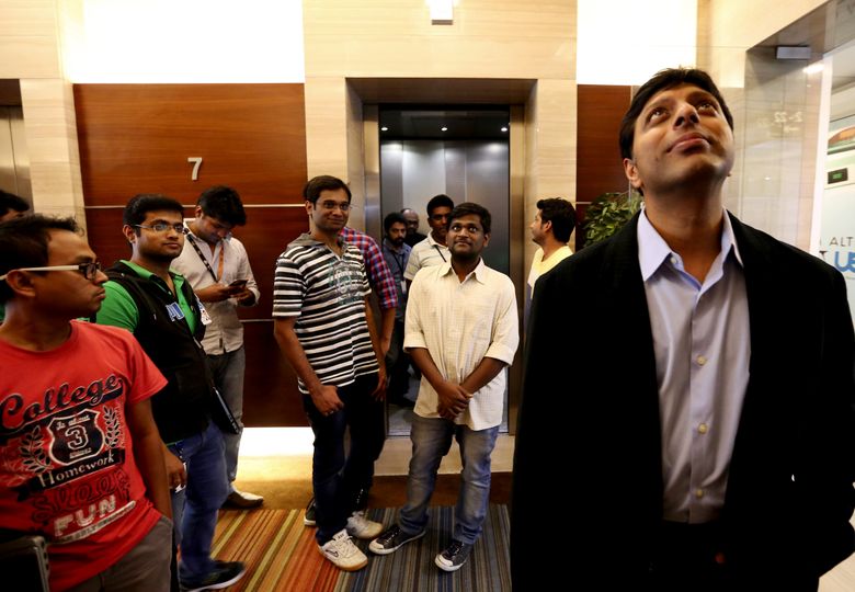 Amit Agarwal, head of Amazon in India, waits for an elevator to his office in Bangalore. (Alan Berner / The Seattle Times)