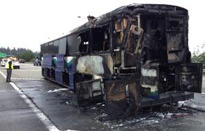A bus fire on I-405 near I-90 may have started at a rear tire, a Washington State Patrol spokesman said on Wednesday, Oct. 14, 2015.