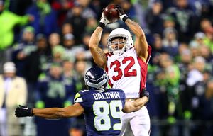 Cardinals safety Tyrann Mathieu intercepts a pass intended for Seahawks wide receiver Doug Baldwin during the third quarter at CenturyLink Field on Sunday, November 15, 2015, in Seattle, Wash.