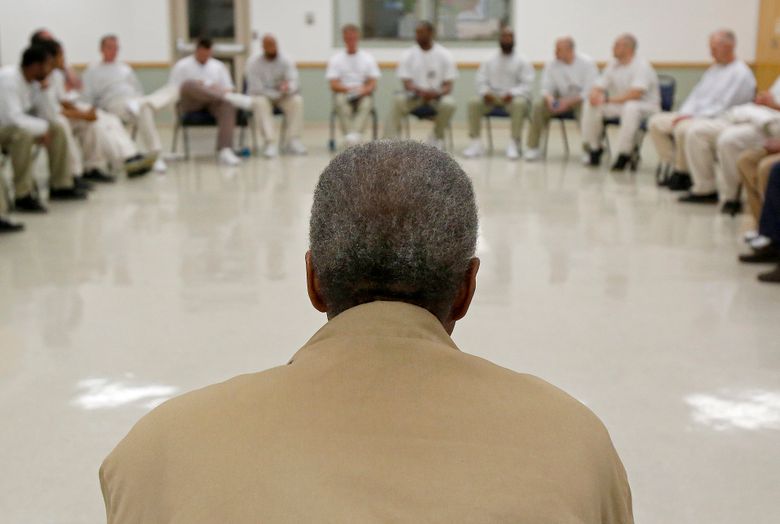 Long-serving prisoner Antonio Wheat listens during a meeting of the Concerned Lifers Organization as other inmates at the Monroe Correctional Complex speak about their recent conference. (Sy Bean / The Seattle Times)