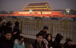 People leave Tiananmen Square on a day with poor air quality in Beijing, Saturday, Nov. 28, 2015. (AP Photo/Mark Schiefelbein)