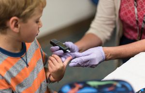 Falmouth Elementary first grader Owen Pollard, 6, has his blood sugar carbohydrate levels checked by Kellie Schimelman, a nurse who can administer insulin if needed, at the school in Falmouth, Maine, Sept. 3, 2015. Many schools are not carrying out their obligation to provide care for children with Type 1 diabetes, federal regulators and diabetes experts say. (Alexandra Daley-Clark/The New York Times)