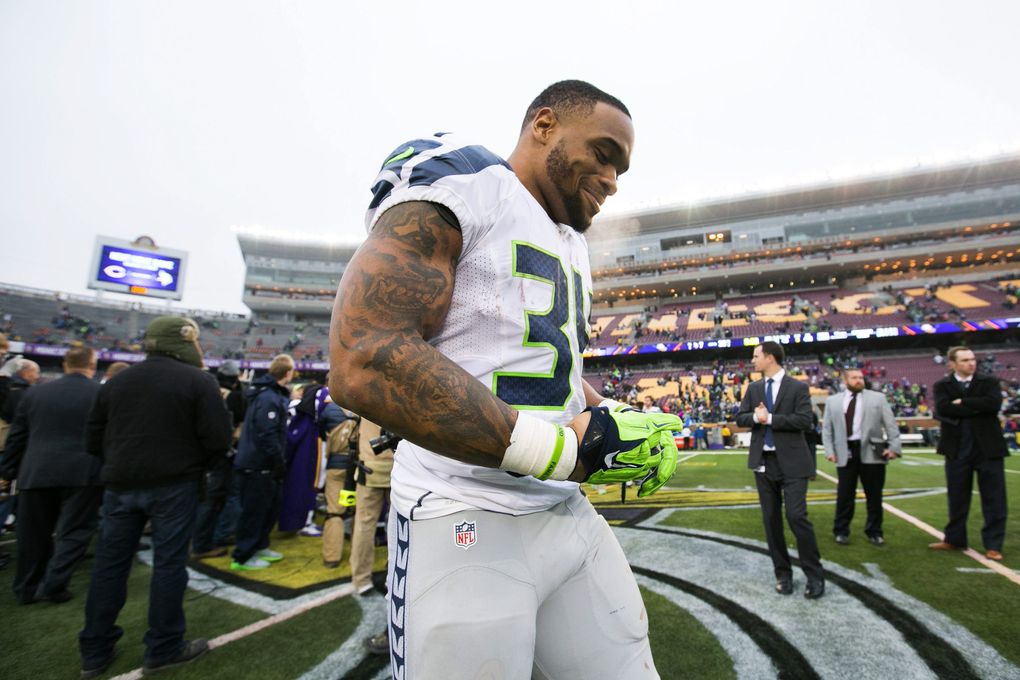 Seahawks running back Thomas Rawls walks off the field after he rushed for 101 yards on 19 carries against the Vikings on Sunday in Minneapolis. (Bettina Hansen / The Seattle Times)