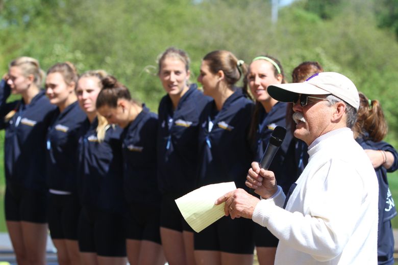 Bob Ernst, former Washington Huskies women’s crew coach,  speaks in front of the UW women’s varsity  eight during the awards ceremony at the 2015 Windermere Cup. (John Lok / Seattle Times staff)