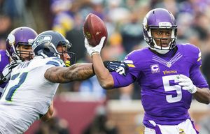 Bruce Irvin takes a swipe at the throwing arm of Minnesota quarterback Teddy Bridgewater, forcing a fumble that the Vikings would recover on the 18-yard line with just over 4 minutes to play in the 3rd quarter. The Seattle Seahawks played the Minnesota Vikings Sunday, December 6, 2015 at TCF Bank Stadium in Minneapolis.