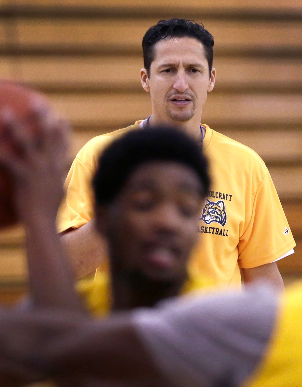In this Tuesday, Dec. 8, 2015 photo, Abe Mashhour, head basketball coach at Schoolcraft College, observes a practice session in Livonia, Mich. “I like coaching a lot but I love working with people,” said Mashhour, a husband and father of six who has coached for 20 years and also serves as athletic director in the Dearborn Public Schools. “For me to help somebody in their life is a lot more significant … than to win basketball games. I get a lot more joy out of that.” (Carlos Osorio / The Associated Press)