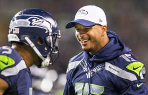 Jermaine Kearse congratulates the defense on a play in a preseason game at CenturyLink Field Friday, Aug. 14, 2015.