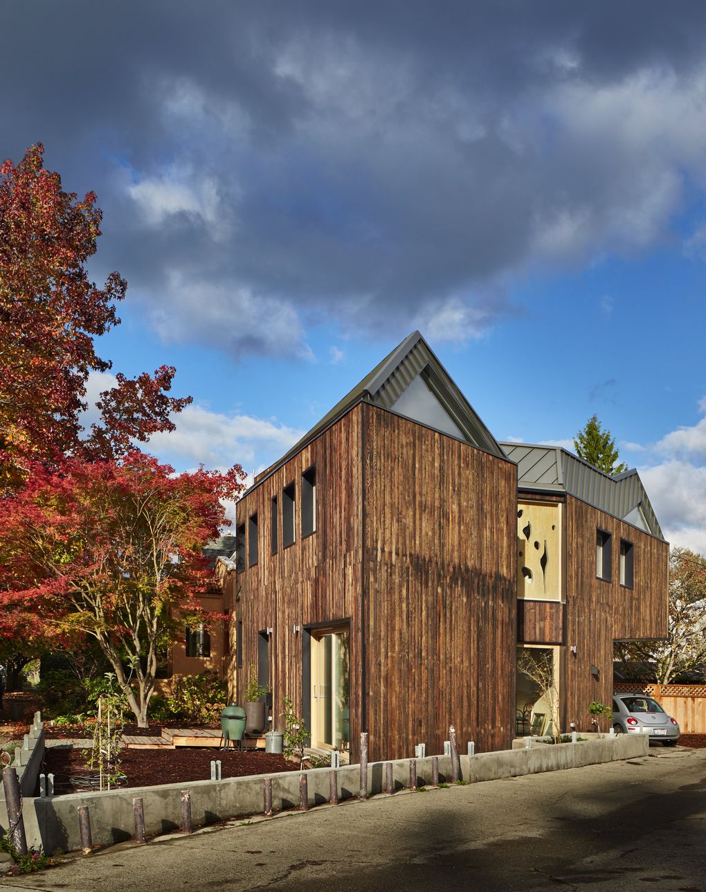 The 1,486-square-foot CLTHouse in Madison Park, clad in charred shou-sugi-ban Douglas fir, follows the triangular angles of its “leftover” 2,500-square-foot lot. The home has three bedrooms and 2.5 baths. (Benjamin Benschneider/The Seattle Times)
