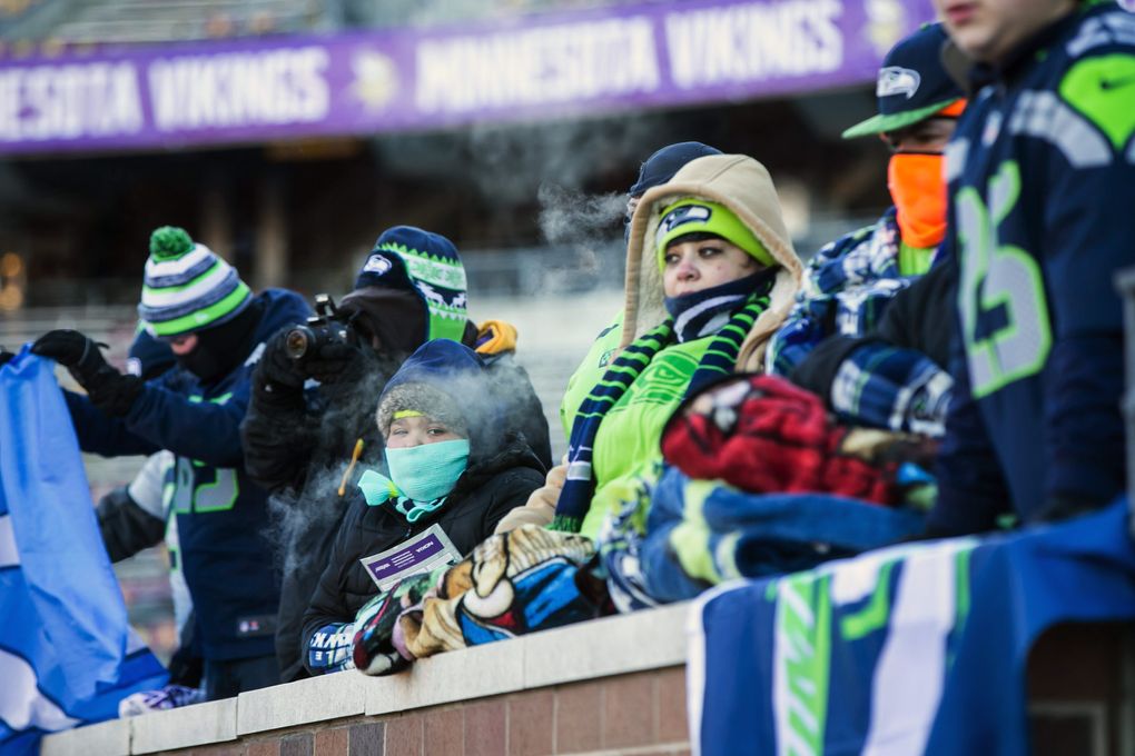 Seahawks fans come towards the bench during warmups. (Bettina Hansen / The Seattle Times)