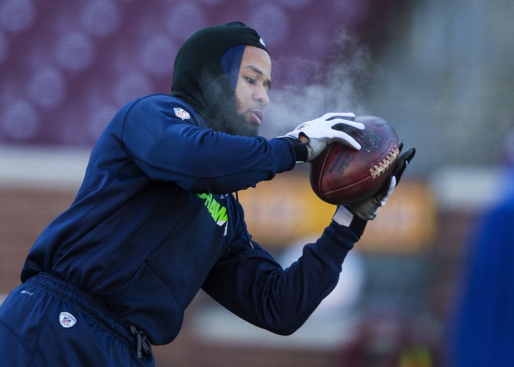 Earl Thomas warms up in the sub-zero temperatures. (Dean Rutz / The Seattle Times)