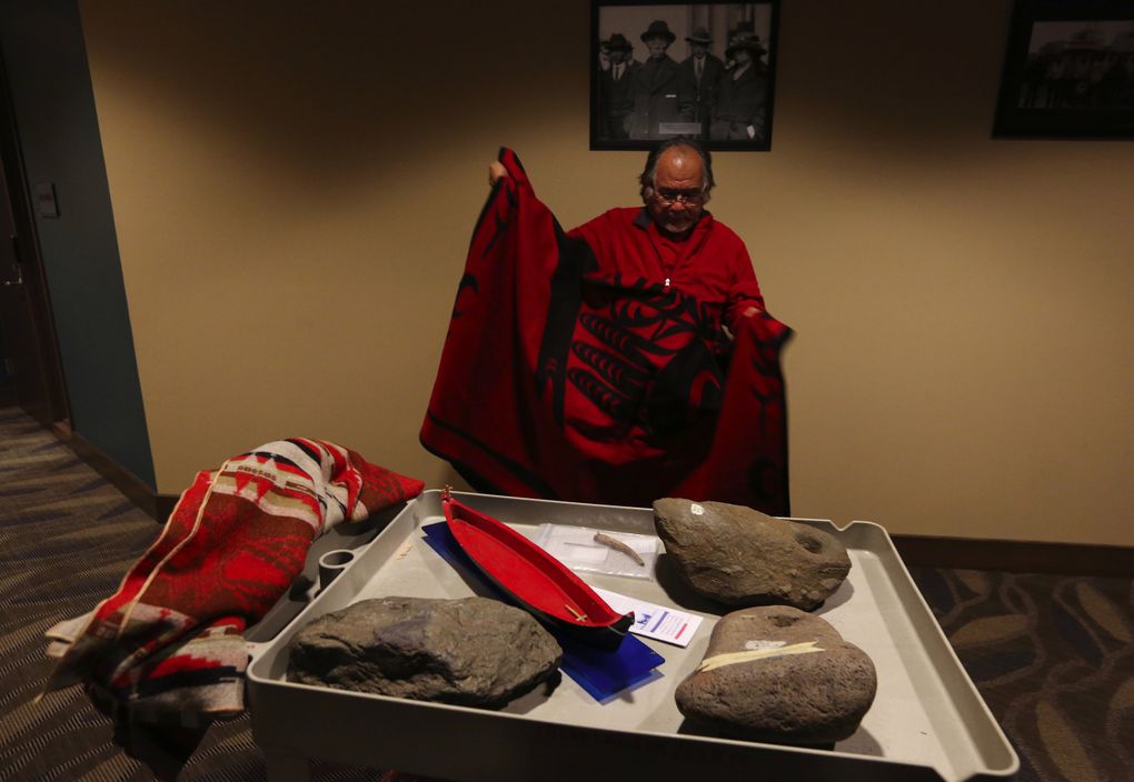 Lummi cultural leader Al Scott Johnnie with ancient reef net anchors, which are significant tribal artifacts at least 2,500 years old found at Cherry Point. The tribe has been using reef nets for fishing for untold generations. (Alan Berner/The Seattle Times)