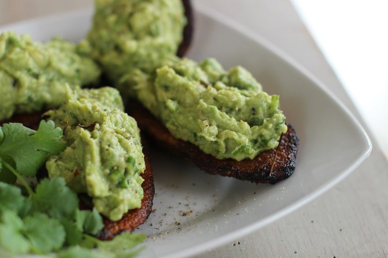 For this easy Super Bowl snack, combine two of our favorite game-day indulgences, guacamole and roasted potato skins. (Matthew Mead/The Associated Press)