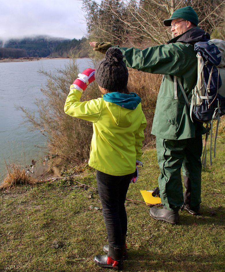 U.S. Forest Service ranger Matthew Riggen leads a walk to the edge of the Skagit River to watch for wintering bald eagles. (Christy Karras)