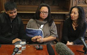 Michelle Mallari holds a press conference at her lawyer’s office. Mallari was shot while watching a movie in Renton. At left is her long-time boyfriend, Richard Arreola.
At far right is her attorney Karen Kohler (in black).
