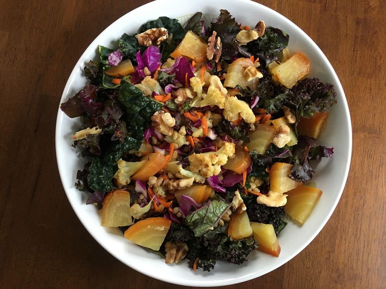 Kale, cauliflower, yellow beets and chopped walnuts combine for a colorful, tasty salad.