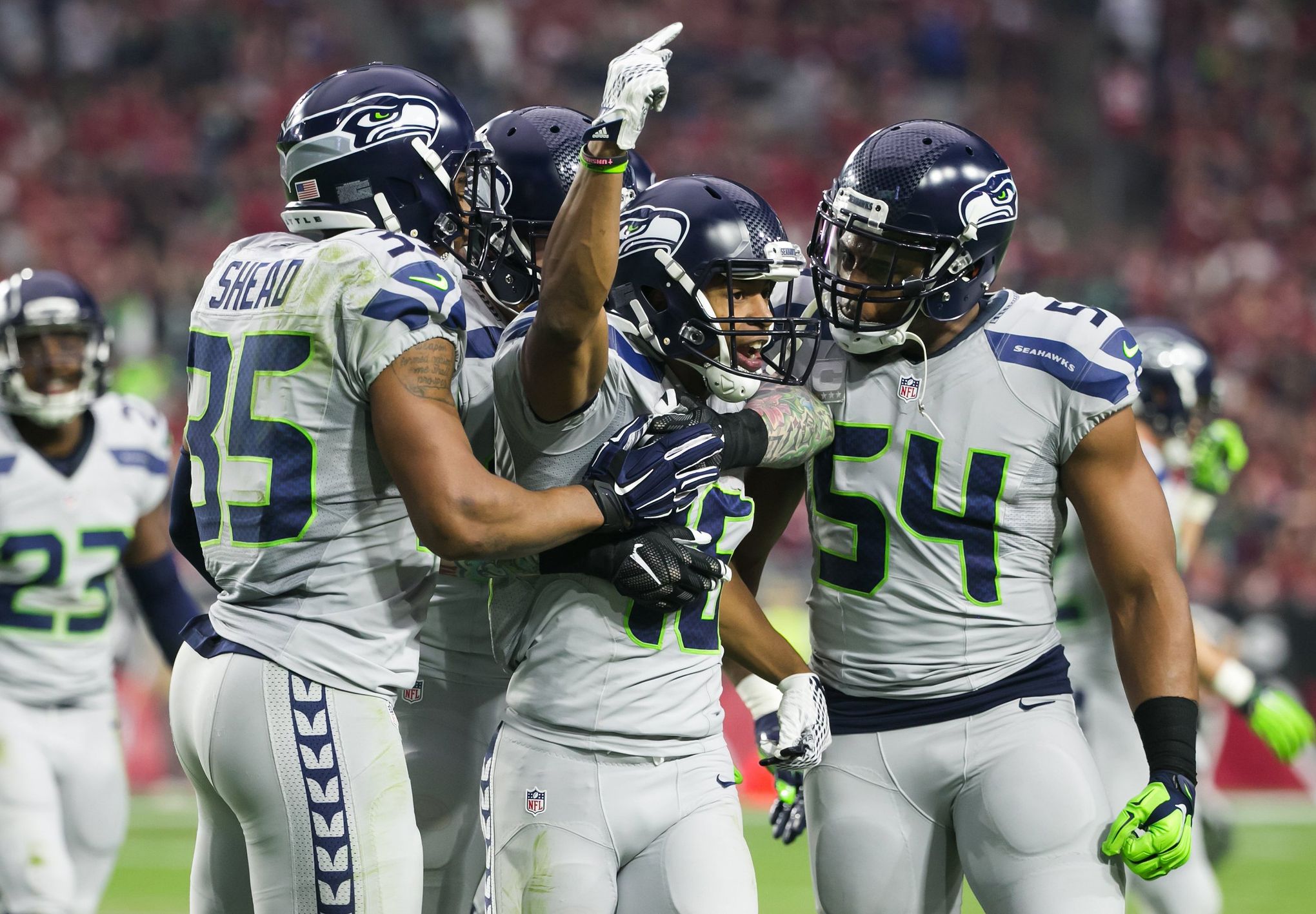 Wide receiver Tyler Lockett of the Seattle Seahawks smiles between