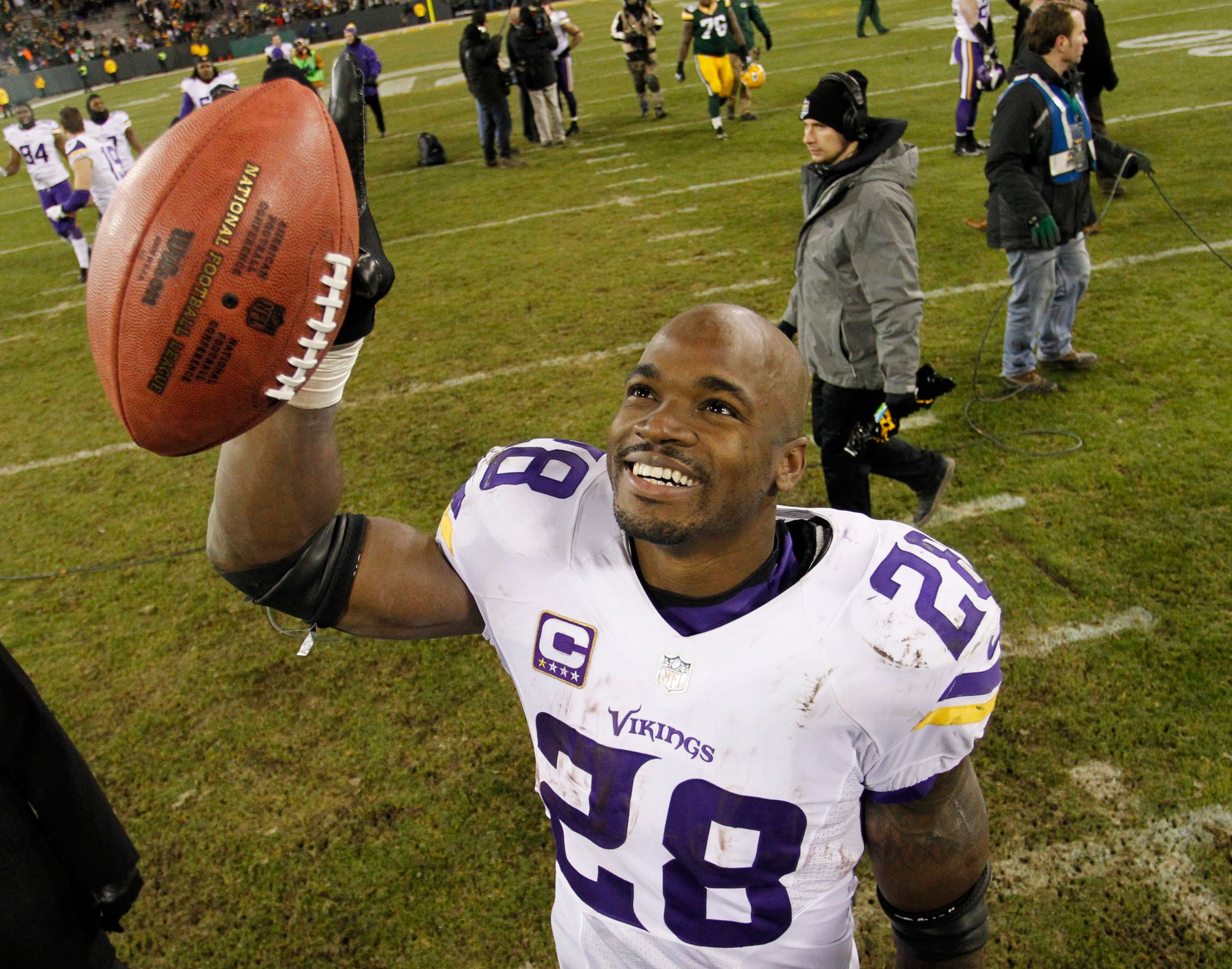 Adrian Peterson of the Minnesota Vikings rushes with the ball against