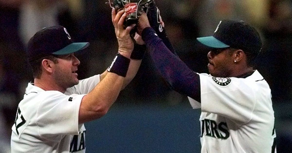 Seattle Mariners greats Edgar Martinez, left, and Ken Griffey Jr. pose for  photos after they raised a flag for the 2023 All-Star Game on the roof of  the Space Needle, Thursday, Sept.