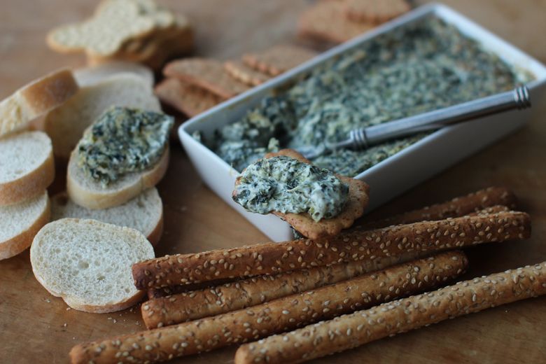 Hot and creamy pesto spinach dip (Matthew Mead/AP)