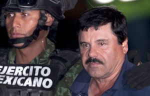 Mexican drug lord Joaquin “El Chapo” Guzman, right, is escorted by soldiers and marines to a waiting helicopter, at a federal hangar in Mexico City, Friday, Jan. 8, 2016. The world’s most wanted drug lord was recaptured by Mexican marines Friday, six months after he fled through a tunnel from a maximum security prison in an escape that deeply embarrassed the government and strained ties with the United States.(AP Photo/Marco Ugarte)