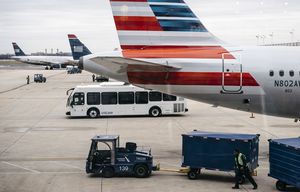 Ronald Reagan Washington National Airport in Arlington, Va., Feb. 4, 2016. Mergers of companies like American and US Airways have left 80 percent of seat capacity in the hands of the four largest airlines, and passenger ticket prices have seen little change, despite airlines benefiting from lower jet fuel costs. (Jared Soares/The New York Times)