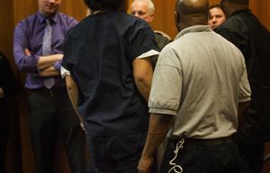 One of the three teenage boys arrested in connection with the deadly shooting last week in the homeless encampment known as The Jungle  leaves a Seattle juvenile courtroom Tuesday, February 2, 2016.