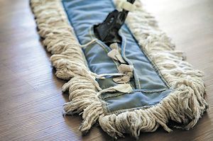 Before applying any cleaner to your hardwood floors, get rid of dirt and debris by sweeping thoroughly or vacuuming with a soft brush attachment. (Katelin Kinney / Angie’s List)