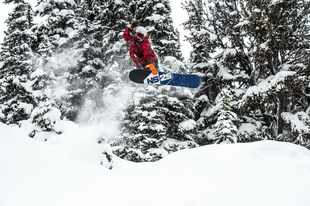 A snowboarders catches air at Whistler-Blackcomb Resort. Photo courtesy of Logan Swayze at Coast Mountain Photography and Whistler-Blackcomb Resort.
