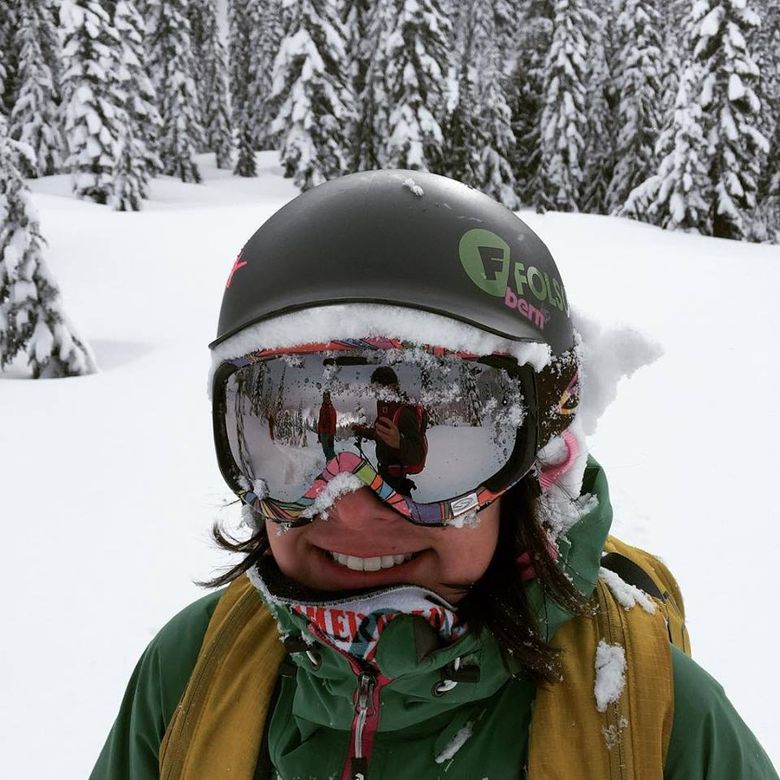 Smiling faces like skier Holly Sato of Seattle will be common place for days to come on the mountains as more snow is expected to fall.
