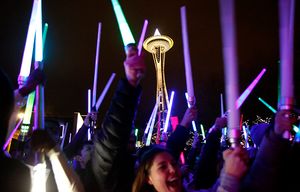 Several hundred Star Wars fans gather underneath the Space Needle Saturday night to wage a lightsaber battle, December 19, 2015. The light saber battle, which also took place in Los Angeles, New York, San Diego, San Francisco, and other cities, coincided with the opening of “Star Wars: The Force Awakens.”
