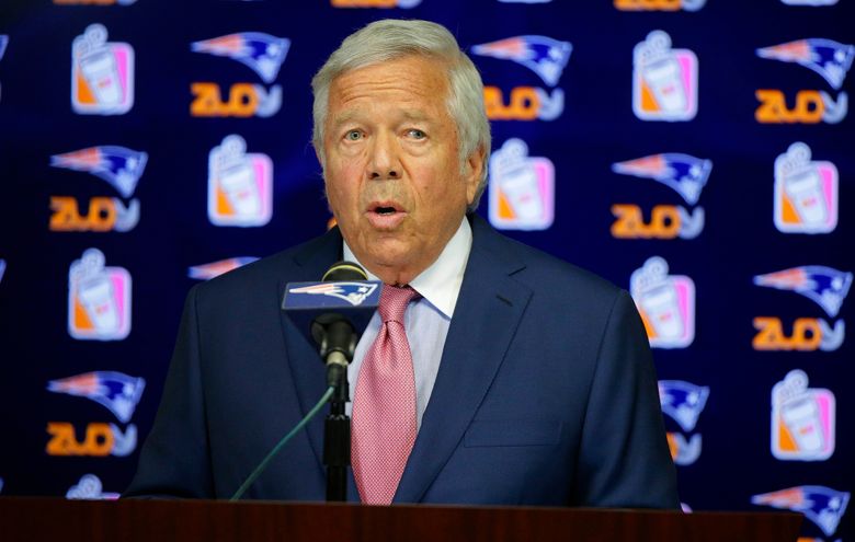 New England Patriots owner Robert Kraft talks with quarterback Tom