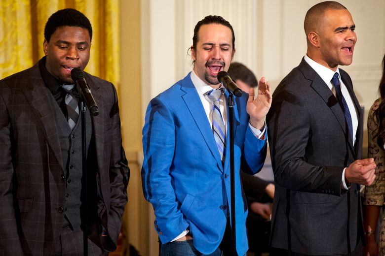 Actor Okieriete Onaodowan, left, actor Lin-Manuel Miranda, and actor Christopher Jackson perform the song “Alexander Hamilton” from the Broadway play “Hamilton” in the East Room of the White House, in Washington, Monday, March 14, 2016. (AP Photo/Jacquelyn Martin)