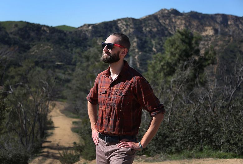 Casey Schreiner, the founder of Modernhiker.com, an interactive guide to hiking throughout Southern California and the West, is photographed on the Beacon Hill trail in Los Angeles’ Griffith Park. (Katie Falkenberg / Los Angeles Times)