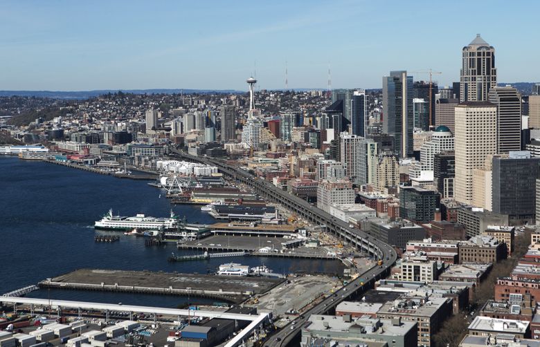 The Seattle waterfront and the Alaskan Way Viaduct are seen from the south in an aerial photo taken in March.  (Lindsey Wasson / The Seattle Times)
