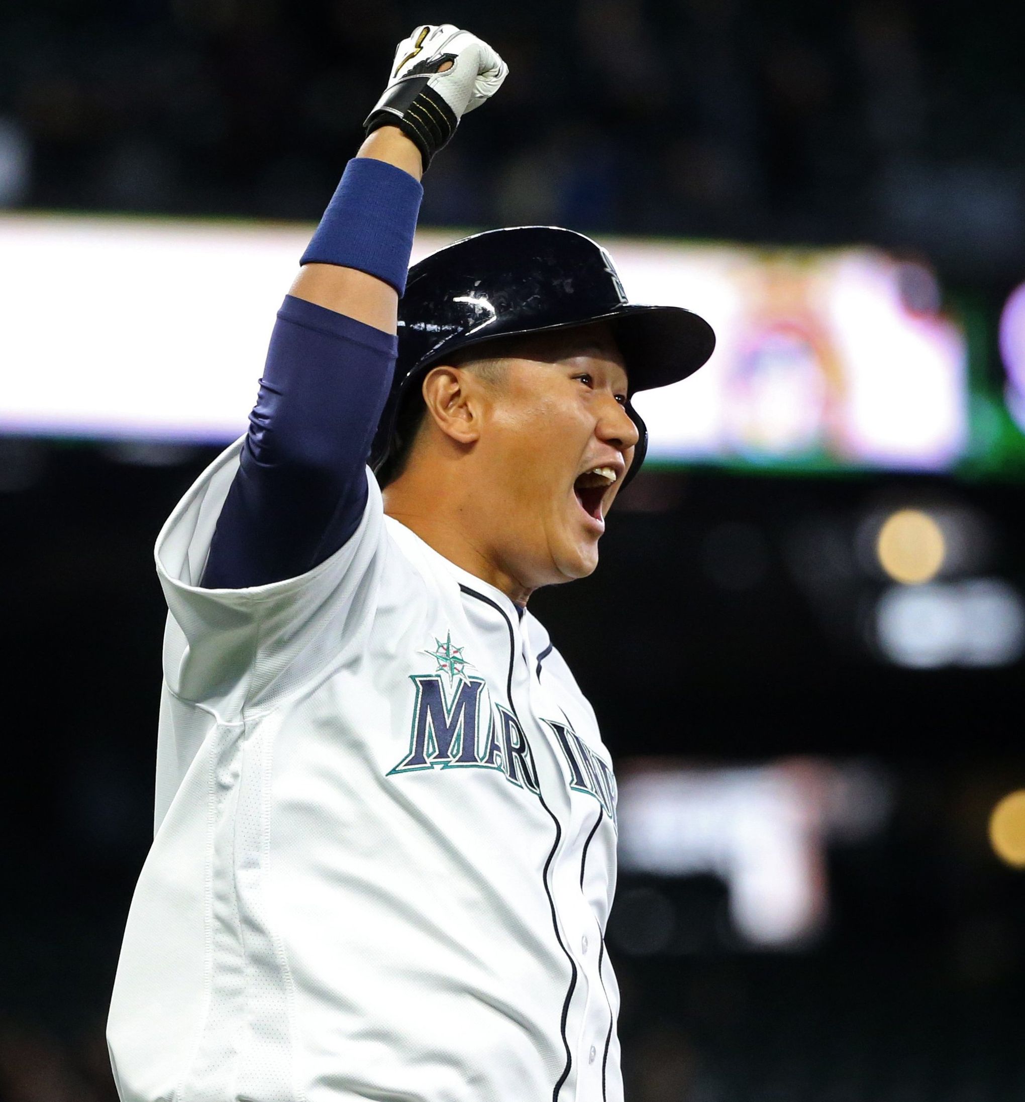 Seattle Mariners first baseman Dae-Ho Lee reacts after a ball hit