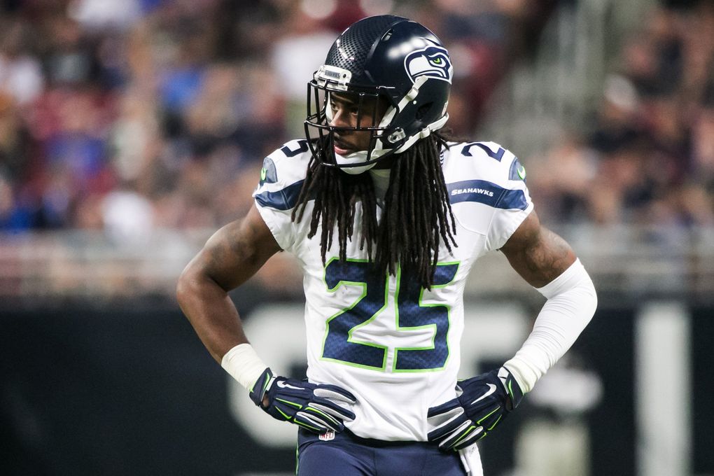 Seahawks cornerback Richard Sherman rests between plays against the Rams on Sept. 13, 2015, in St. Louis. (Bettina Hansen / The Seattle Times)