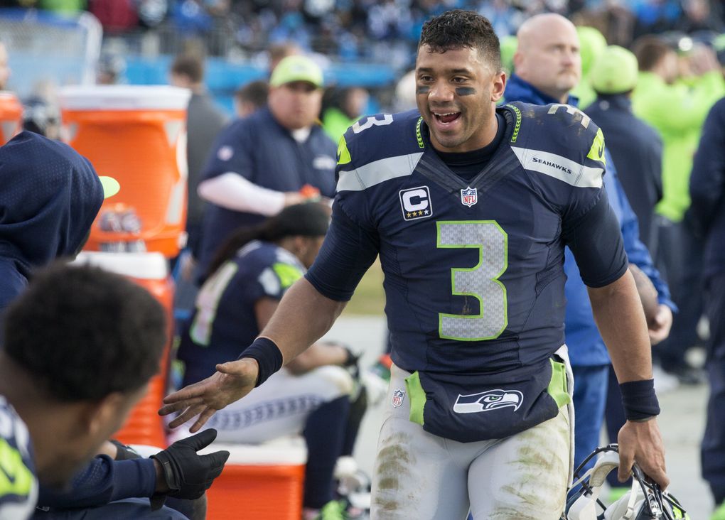 Seahawks quarterback Russell Wilson encourages his team during Seattle’s NFC Divisional playoff loss to the Carolina Panthers on Jan. 17, 2016. (Mike Siegel / The Seattle Times)