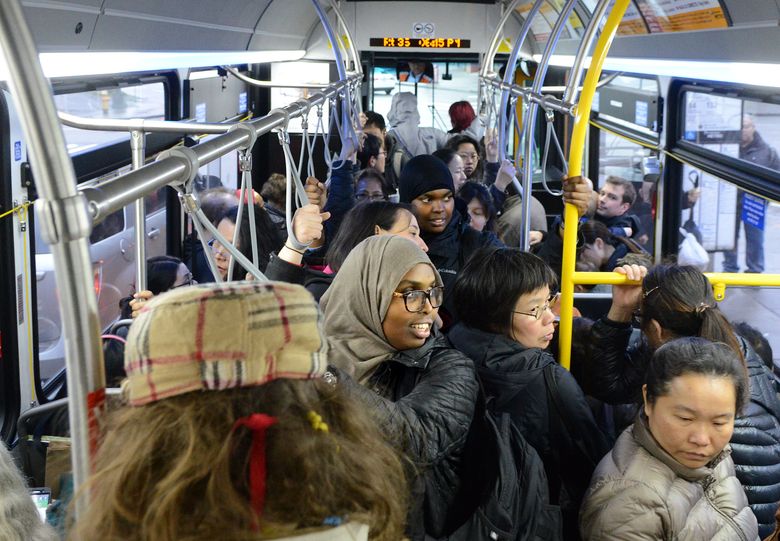 Evening transit riders pack a recent Metro bus on Route 36 in downtown Seattle, which is the second most bus-reliant major city. (Tyler Sipe/The Seattle Times)