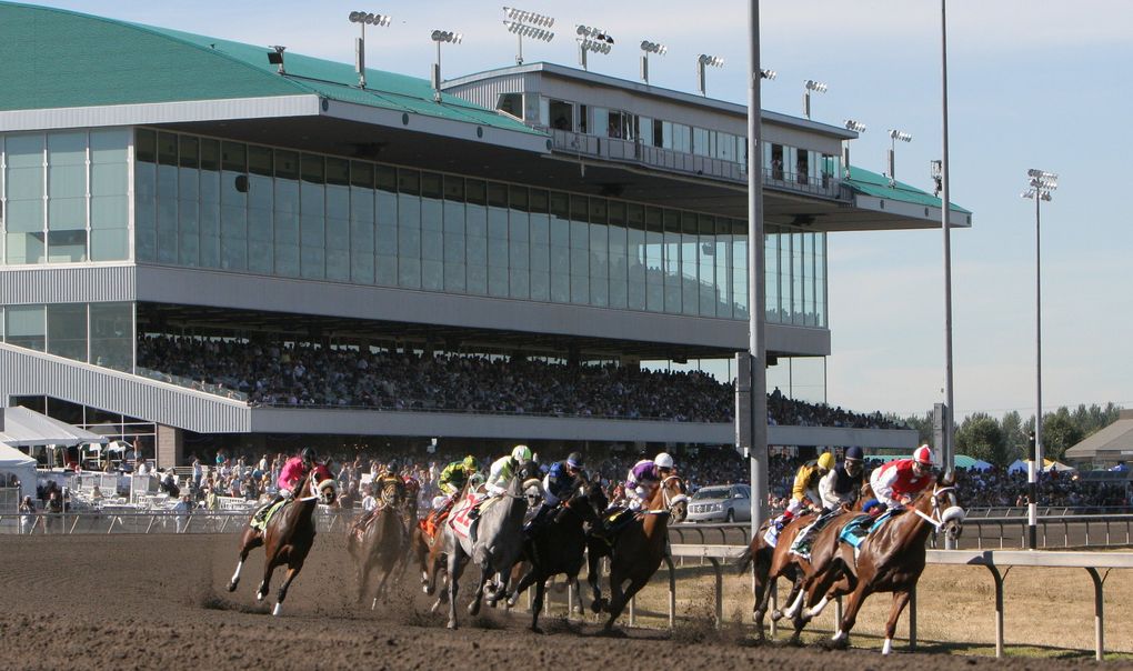 Ricky Frazier on Flamethrowintexan, right, takes an early lead on his was way to victory in the 71st running of the Longacres Mile on Aug. 20, 2006. (Scott Cohen / The Seattle Times)