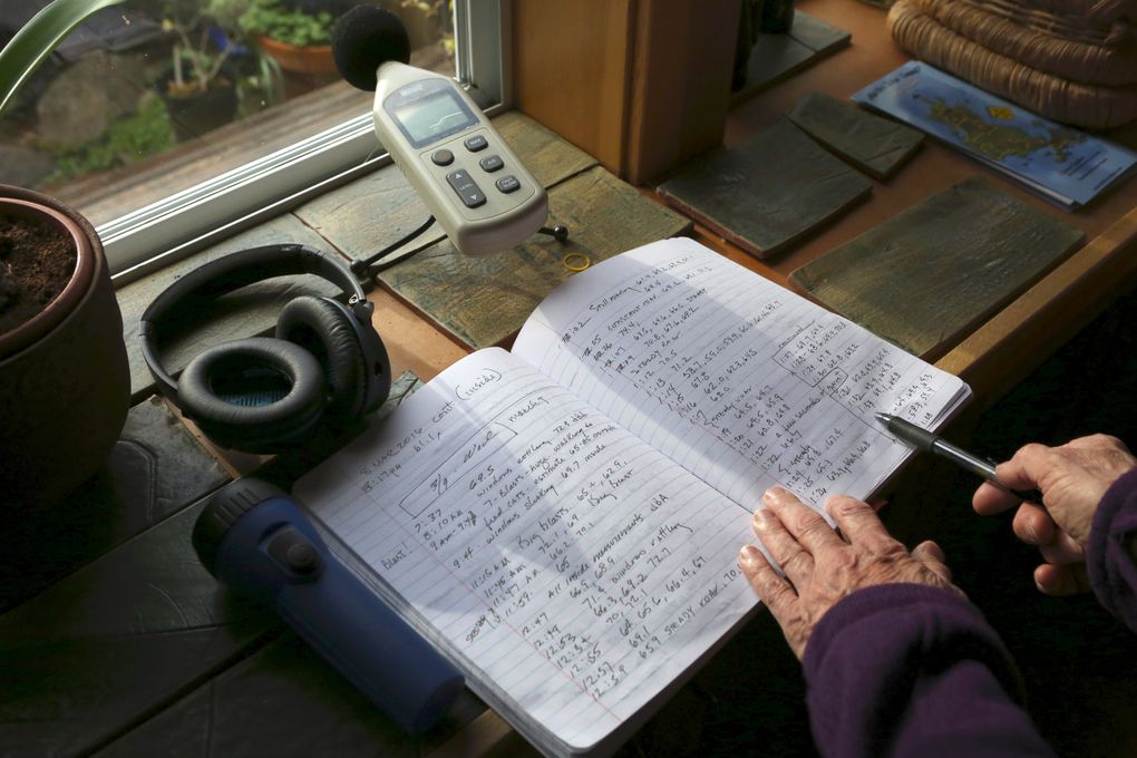 Cynthia Dilling, a longtime Lopez Island resident who can’t stand hearing the Growler jets, keeps a log of readings taken with her decibel meter. She says she’ll often go inside and use these ear protectors when Growlers are flying. (Ken Lambert/The Seattle Times)