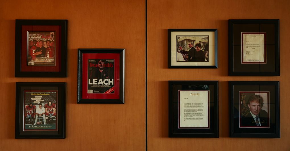 A framed photograph of Donald Trump and George W. Bush hangs in head football coach Mike Leach’s office. (Erika Schultz/The Seattle Times)
