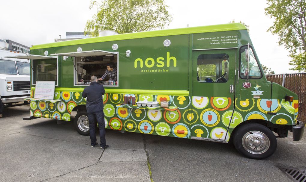 The Nosh food truck goes from Sodo to Lake City Way to Bellevue, dispensing the area’s greatest fish and chips along the way. (Mike Siegel/The Seattle Times)
